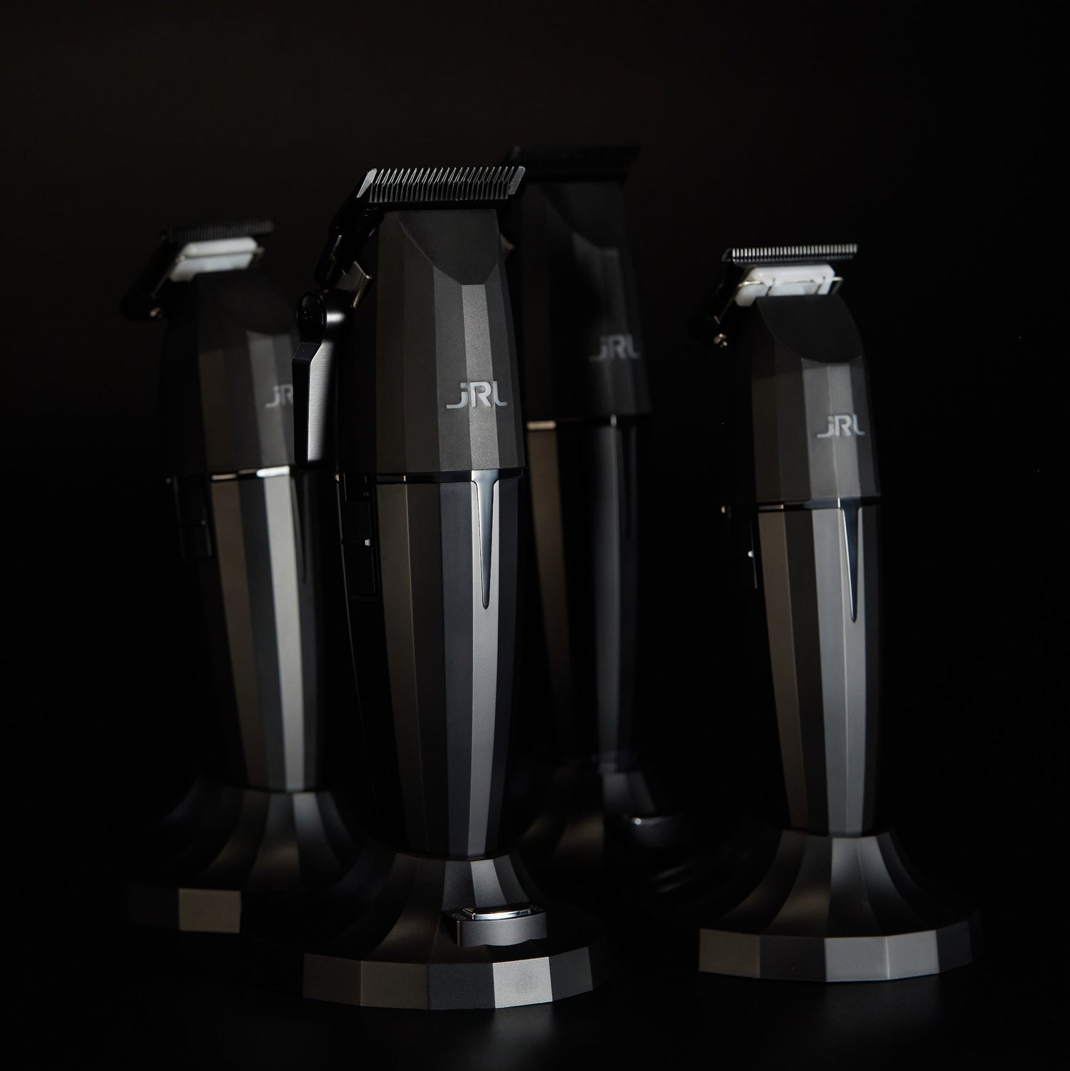 JRL ONYX clippers and trimmers on charging stands